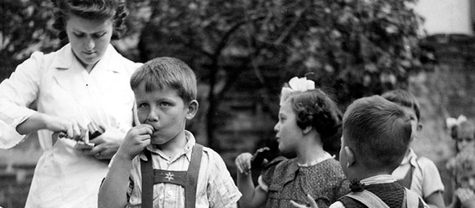 Distribution of chocolate to children in the orphanage for survivors established by the Jewish community after the war, Bratislava Distribution of chocolate to children in the orphanage for survivors established by the Jewish community after the war, Bratislava