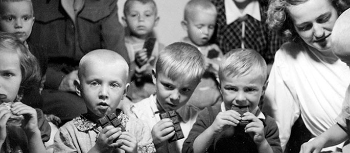 Distribution of chocolate to children in the orphanage for survivors established by the Jewish community after the war, Bratislava Distribution of chocolate to children in the orphanage for survivors established by the Jewish community after the war, Bratislava