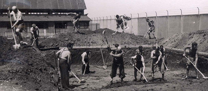 Construction work on the swimming pool in the Nováky forced labor camp for Jews, Slovakia Construction work on the swimming pool in the Nováky forced labor camp for Jews, Slovakia, and camp prisoners spending their free time at the pool