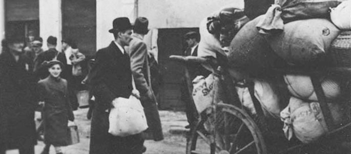 Jews walking next to carts loaded with their personal effects, being deported from Slovakia, 1942 Jews walking next to carts loaded with their personal effects, being deported from Slovakia, 1942