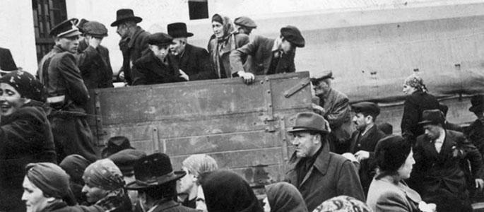 Jews climbing onto trucks, under the supervision of the Slovak militia, being deported from Slovakia, 1942 Jews climbing onto trucks, under the supervision of the Slovak militia, being deported from Slovakia, 1942