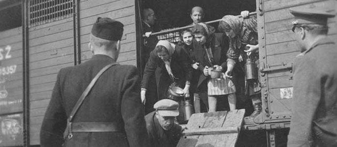 Members of the Slovak militia, locking Jews into a deportation train leaving Slovakia, 1942 Members of the Slovak militia, locking Jews into a deportation train leaving Slovakia, 1942