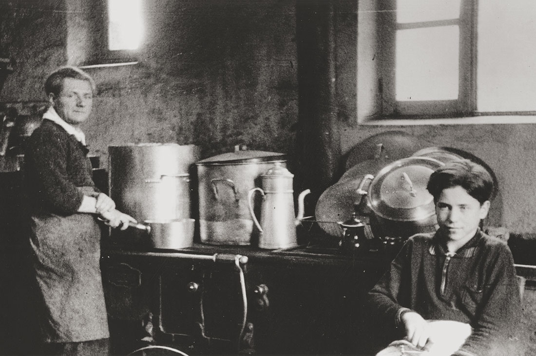 Stephan Lewy working in the kitchen of the Château de Chabannes OSE children's home, 1941