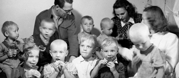 Distribution of chocolate to children in the orphanage for survivors established by the Jewish community after the war, Bratislava