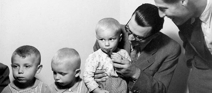 Distribution of chocolate to children in the orphanage for survivors established by the Jewish community after the war, Bratislava