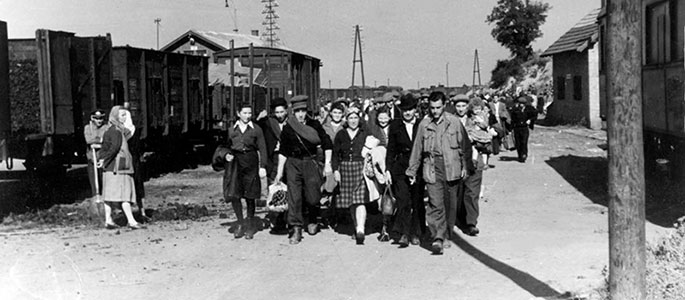Polish Holocaust survivors disembarking from a train along the route of the Bricha Polish Holocaust survivors disembarking from a train along the route of the Bricha