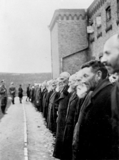 Registration of Jewish men in the courtyard of the Plonsk prison, while being beaten, 19 September 1939 Registration of Jewish men in the courtyard of the Plonsk prison, while being beaten, 19 September 1939