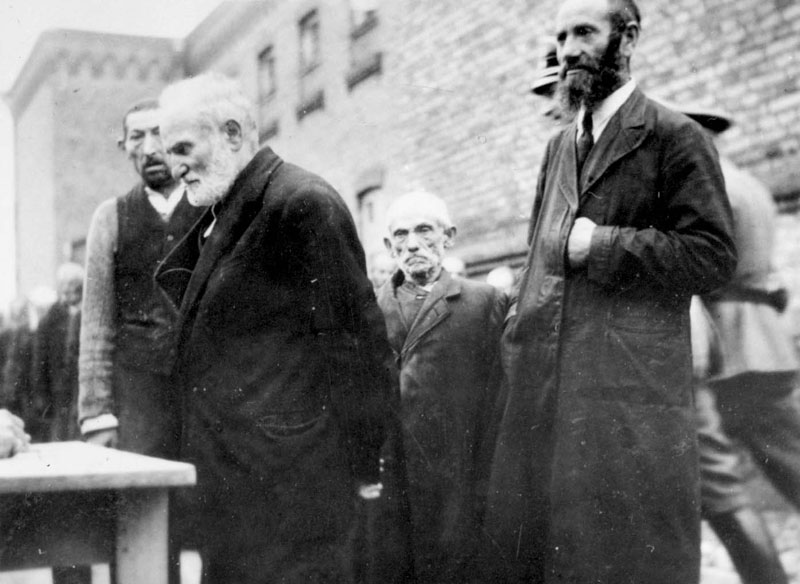Registration of Jewish men in the courtyard of the Plonsk prison, while being beaten, 19 September 1939 Registration of Jewish men in the courtyard of the Plonsk prison, while being beaten, 19 September 1939