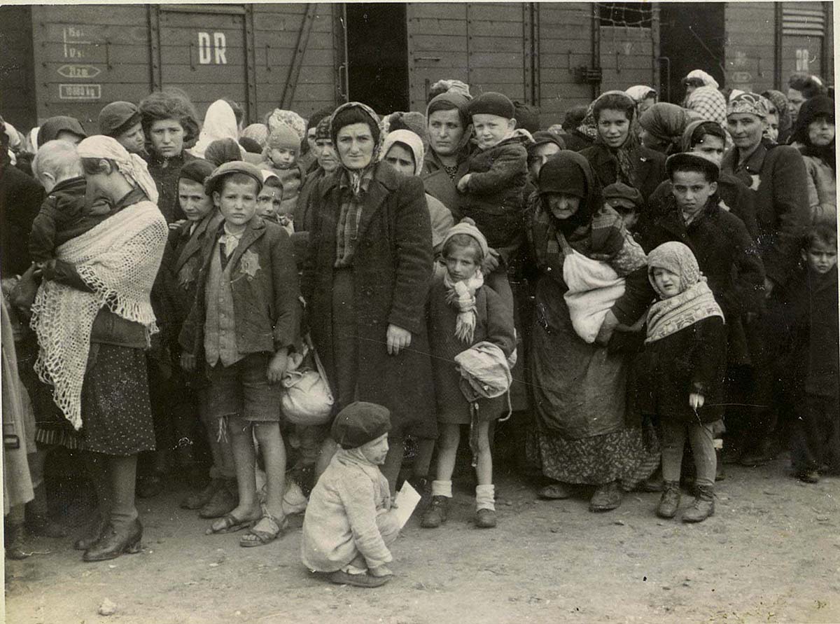Women and children on the Birkenau arrival platform known as the "ramp". The Jews were removed from the deportation trains onto the ramp where they faced a selection process - most of them were sent immediately to their deaths, while others were sent to slave labor