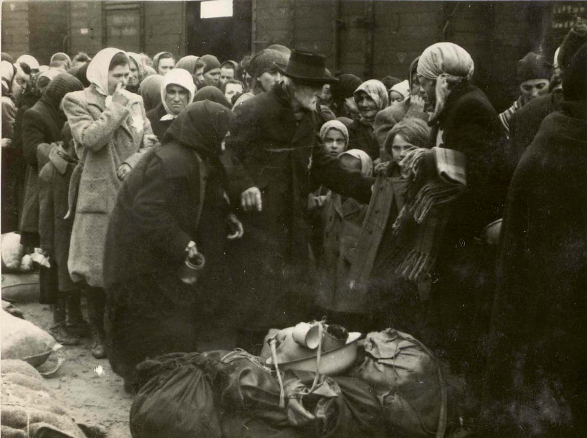 The property that Jews have brought with them is gathered on the ground in one corner