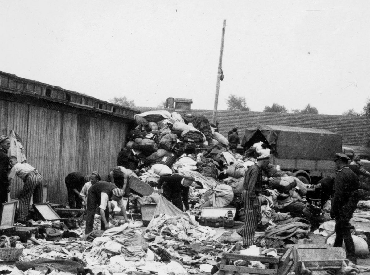 Sorting outside the barracks. A truck has brought a new shipment of confiscated goods