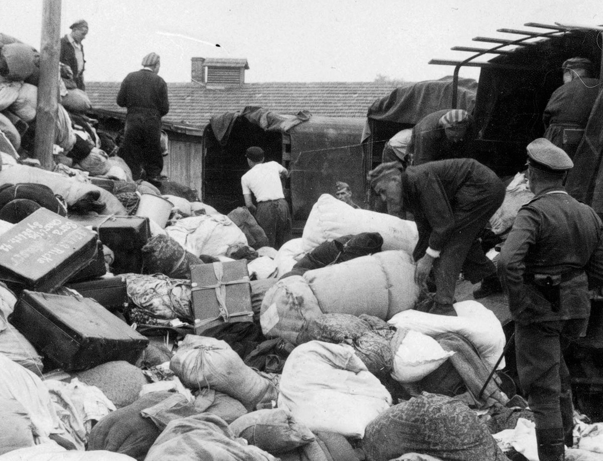 Sorting outside the barracks. A truck has brought a new shipment of confiscated goods