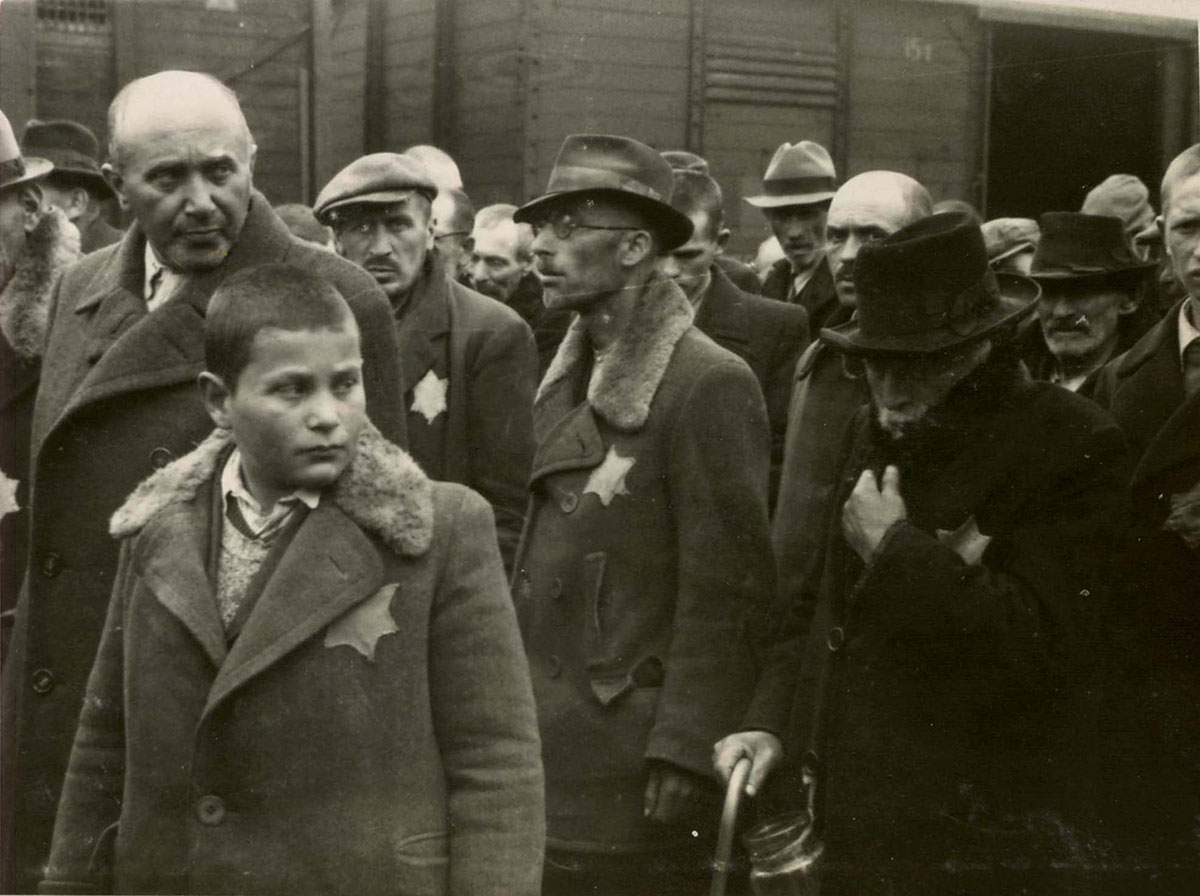 Second row, from left to right: Mr. Smilazick, Sigmund Bruck. First row: Mr. Smilazick's son