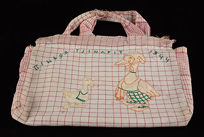 A bag sewn for Aleida-Chana Benninga by her mother and grandmother in camps set up by the Japanese in Indonesia