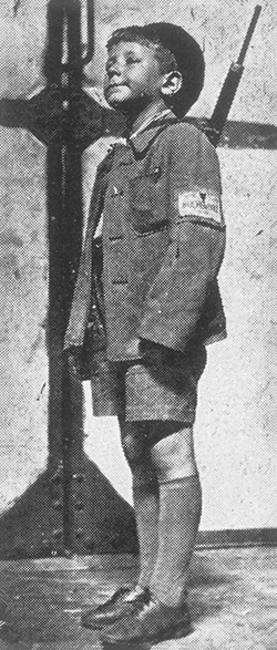 The young boy in this photograph arrived in the Port of Haifa in 1945 with his brother after having been liberated from the Buchenwald camp