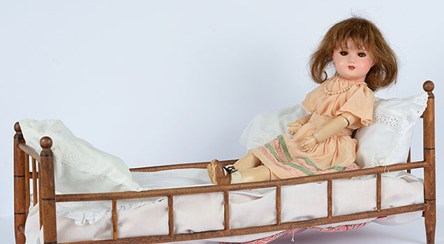 This doll belonged to Claudine Schwartz-Rudel was 7 years old when she fled from Paris to Southern France with her parents