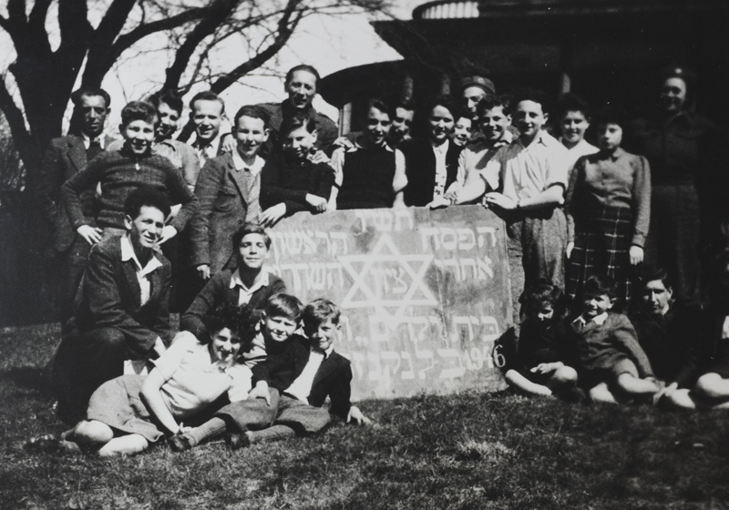 Children, counsellors, teachers and caregivers at the children's home in Blankenese celebrating their first Passover after liberation.  Hamburg, Germany, April 1946