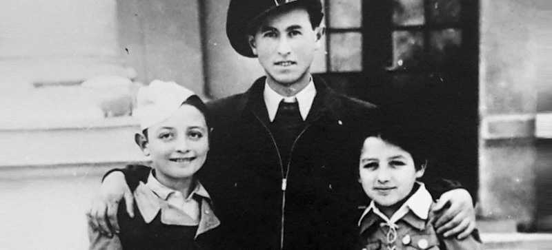 Menachem Berkowitz and the Bleier twins at the youth village in Deszk. Courtesy of the Testimony House Nir Galim