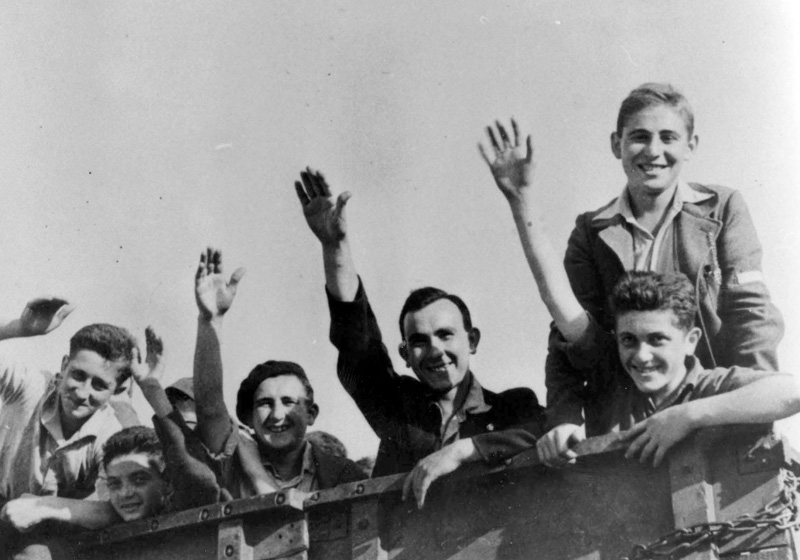 "Buchenwald boys" on a truck en route from the children's home in Écouis, France to Marseille port, the start of their journey to Eretz Israel (Mandatory Palestine), July 1945