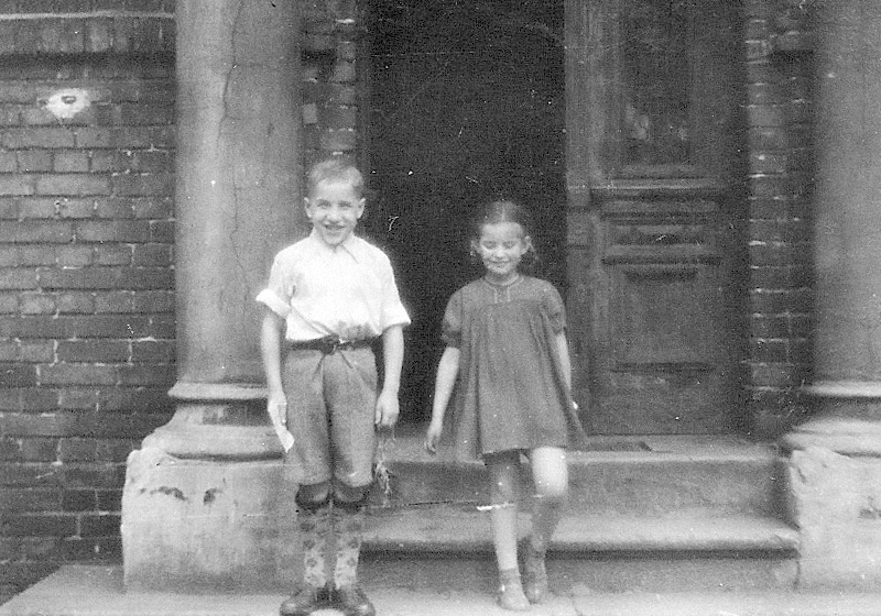 Shimon Huterer and an unidentified girl at the children' home in Zabrze, Poland after the war