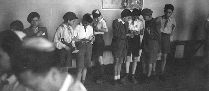 Child survivors during their daytime activity in the Bnei Akiva dormitories. 
Bratislava, 1946