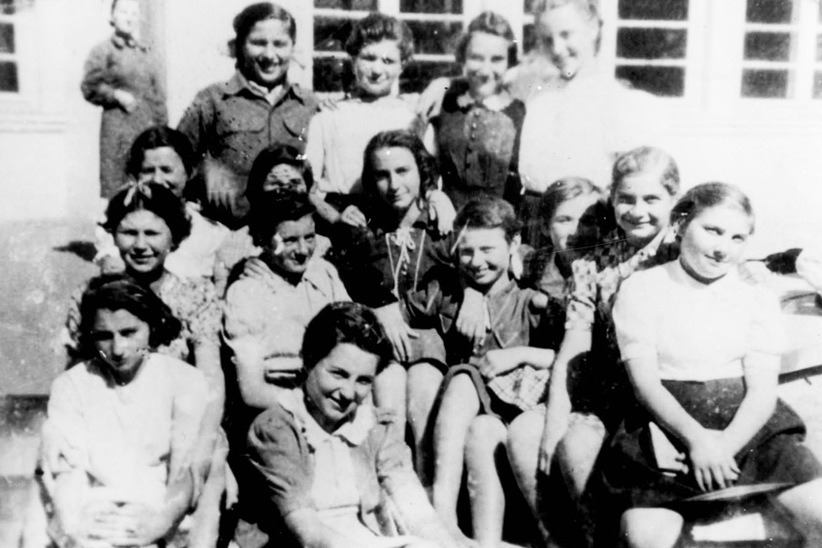 The older group of girls in Otwock in the summer of 1945 with their teacher